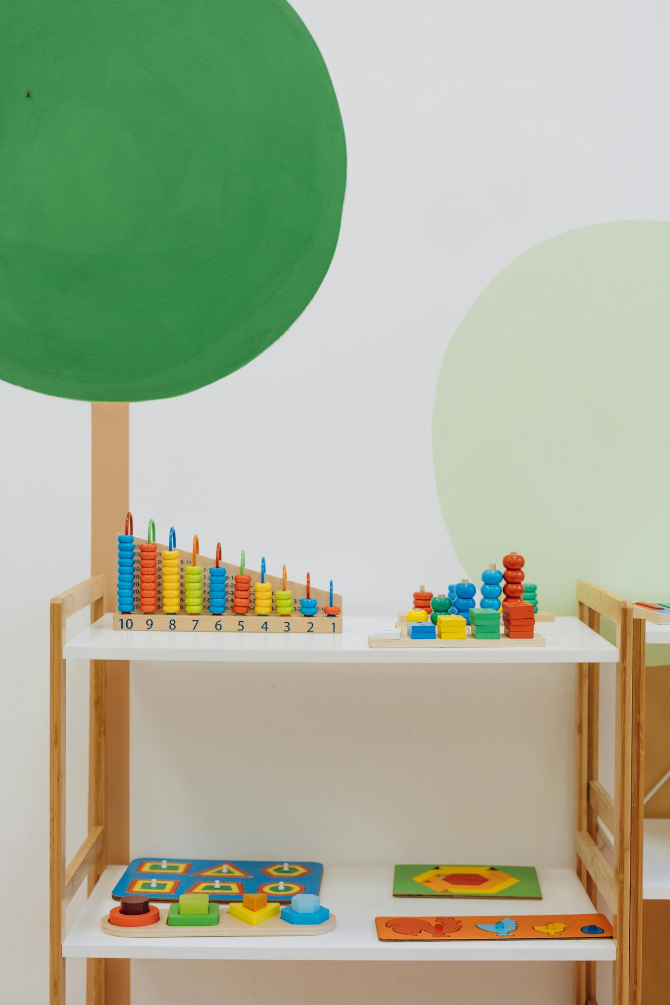 A well-organized indoor playroom filled with colorful educational toys for preschool children.